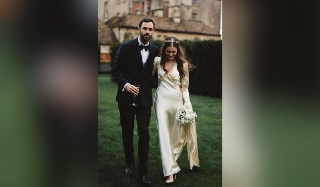 Molly Whitehall with her spouse wearing vintage wedding dress