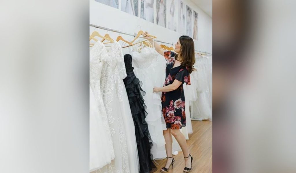 Woman selecting her vintage wedding gown