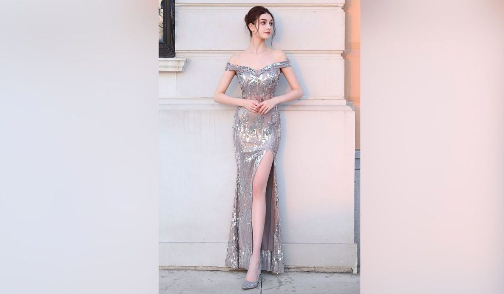 Woman wearing high slit prom gown for 